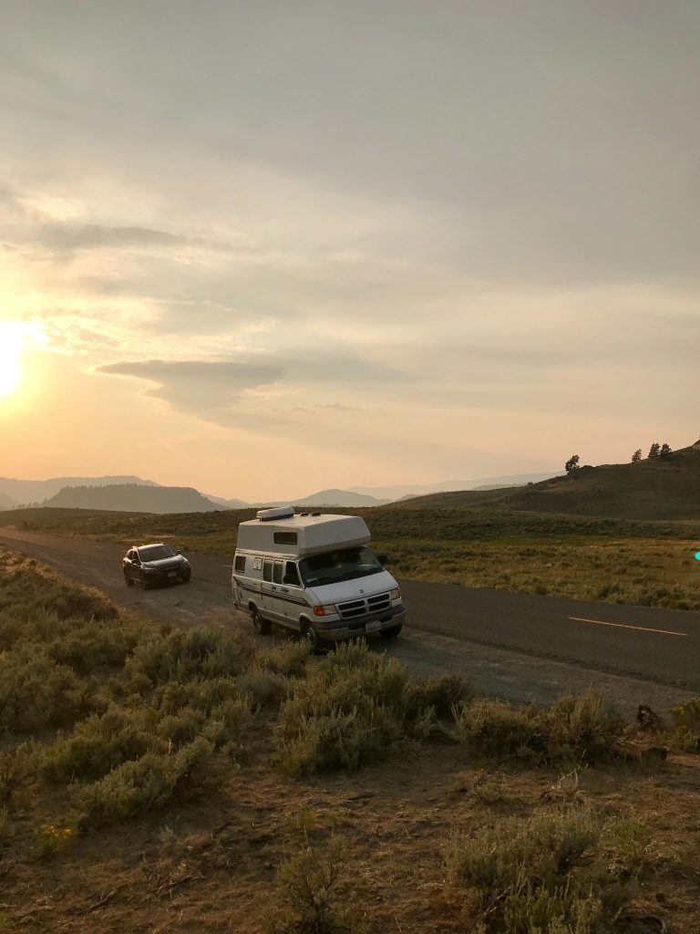 white camper van parked on edge of road
